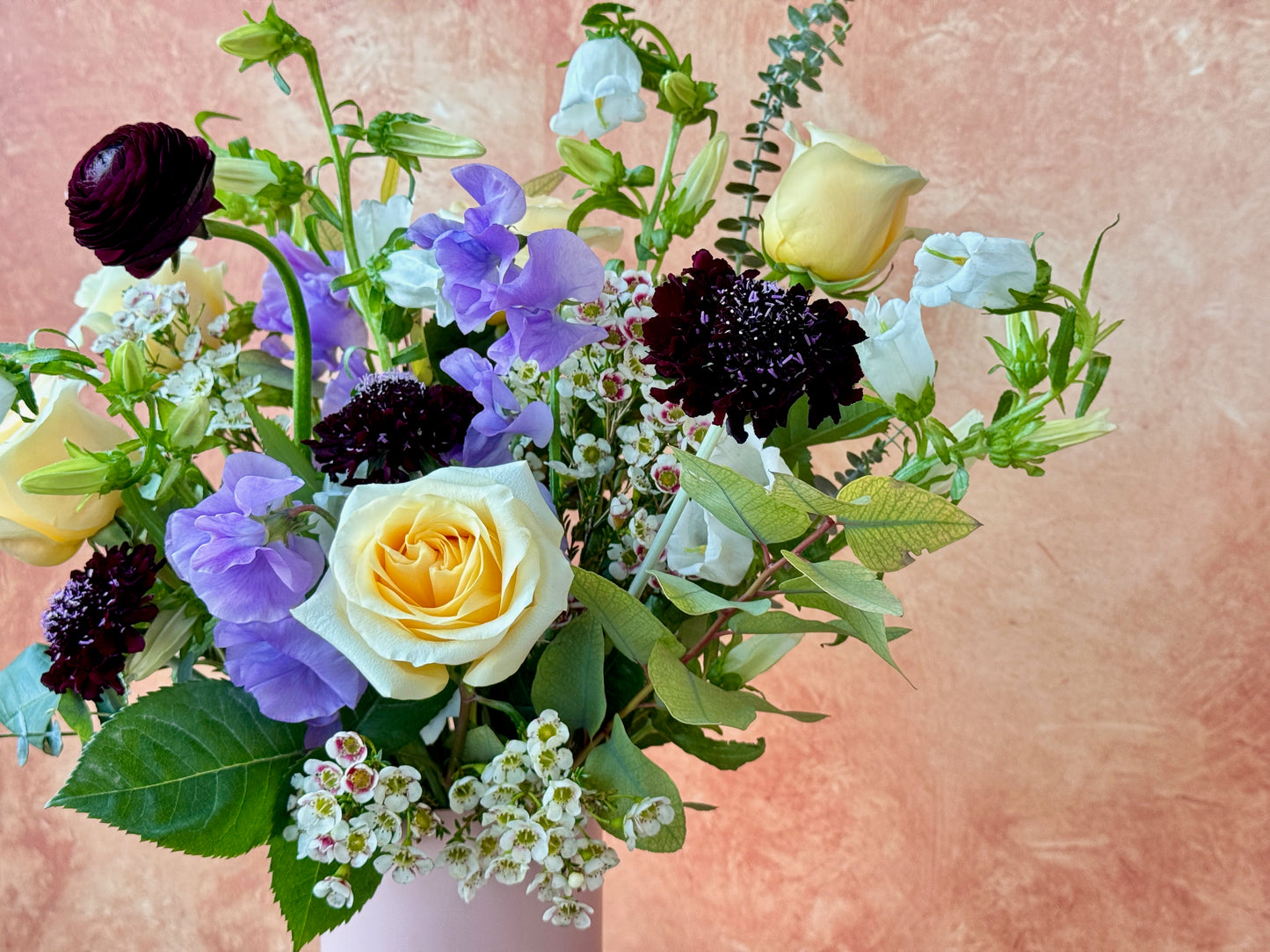 Regina - Yellow and lavender flowers in vase