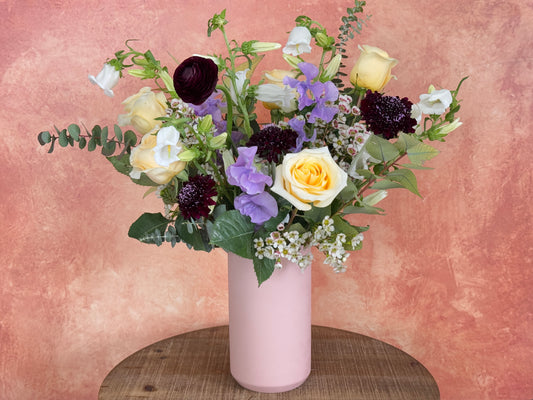 Regina - Yellow and lavender flowers in vase